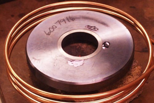Shrink fitting carbide ring into valve seat
