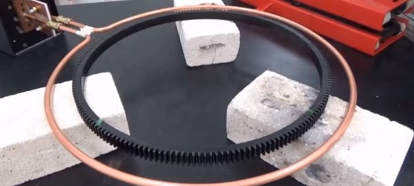 A gear being heated with induction for shrink fitting
