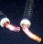image: Braze a stainless steel braided hose to copper elbows
