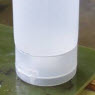 image: Heating pre-assembled plastic tube and cap for cap sealing application