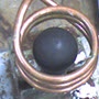 image: Heating a steel ball on a pin by induction for an insertion application