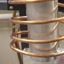 image: Preheating a copper rod and connector [epoxy curing]