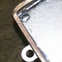 image: Soldering a steel cover onto a nickel plated EMI filter