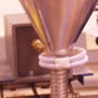 image: Soldering a steel funnel to flex spout