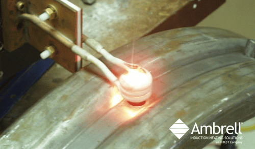 induction forging a steel pin on a rim
