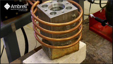 Curing a Coating by Heating a Steel Tube and an Aluminum Block