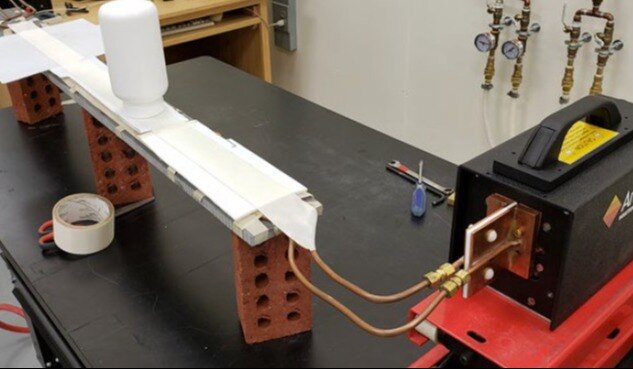 INDUCTION BONDING FOIL TO A PLASTIC BOTTLE