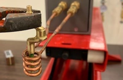 Heat staking a brass shaft with induction heating