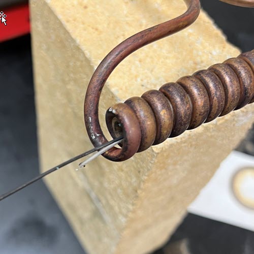 Preheat alloy wire for a continuous extrusion process
