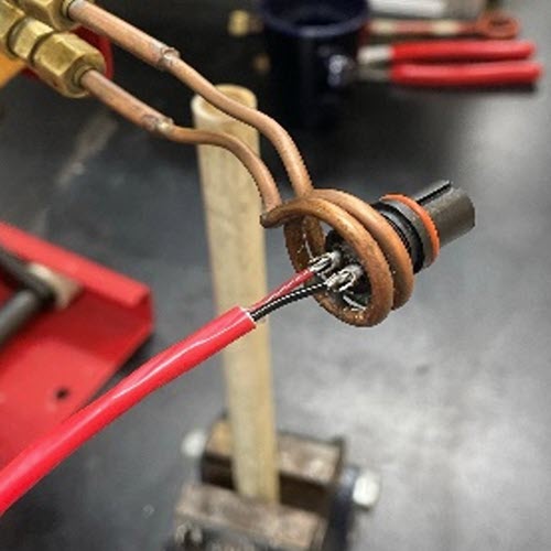 Solder cable and connector assembly to 350-400 °F